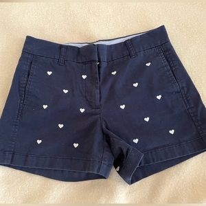 Navy blue Jcrew chino shorts with white heart print, size 4.